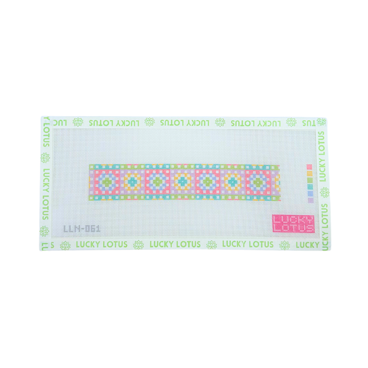 Colorful granny squares needlepoint canvas with pink, blue, green, yellow and lavender motifs, shown with Lucky Lotus canvas tape.