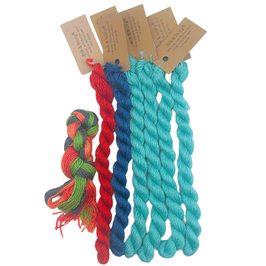 Silk & Ivory needlepoint threads in coral, blue, aqua, green and multicolor for the Coral canvas