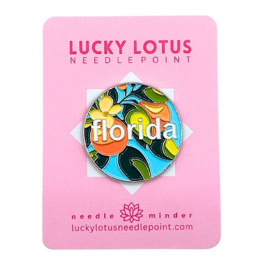 Colorful Florida needle minder with oranges, citrus blossoms, tropical leaves, and Florida lettering by Lucky Lotus Needlepoint.