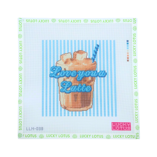 Love You a Latte coffee needlepoint canvas with an iced coffee and whipped cream on a blue striped background, shown with Lucky Lotus canvas tape.