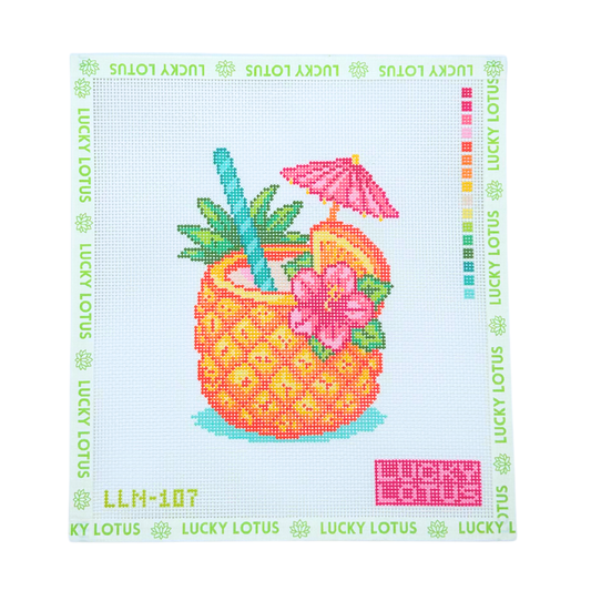 Lucky Lotus Needlepoint pineapple cocktail canvas featuring a tropical drink with pink flowers, citrus slices, palm leaves, and a pink umbrella.