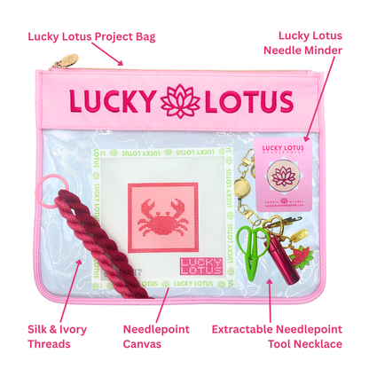 Contents of the Crab Beginner Needlepoint Kit including hand-painted canvas, Silk & Ivory threads, project bag, needle minder, and extractable needlepoint tool keychain.