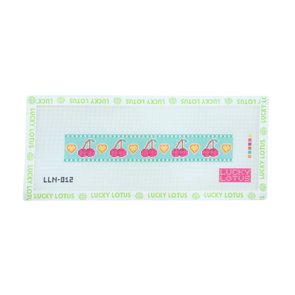 Cherry needlepoint canvas featuring repeating pink cherries and orange hearts on an aqua background