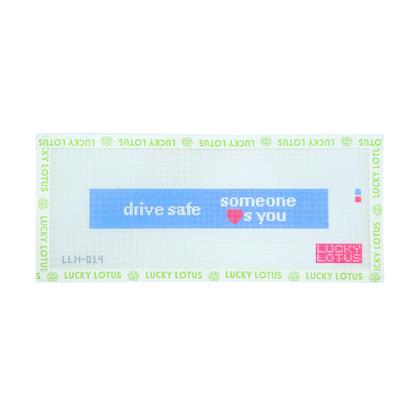 Blue needlepoint canvas with white “drive safe someone loves you” lettering and a pink heart
