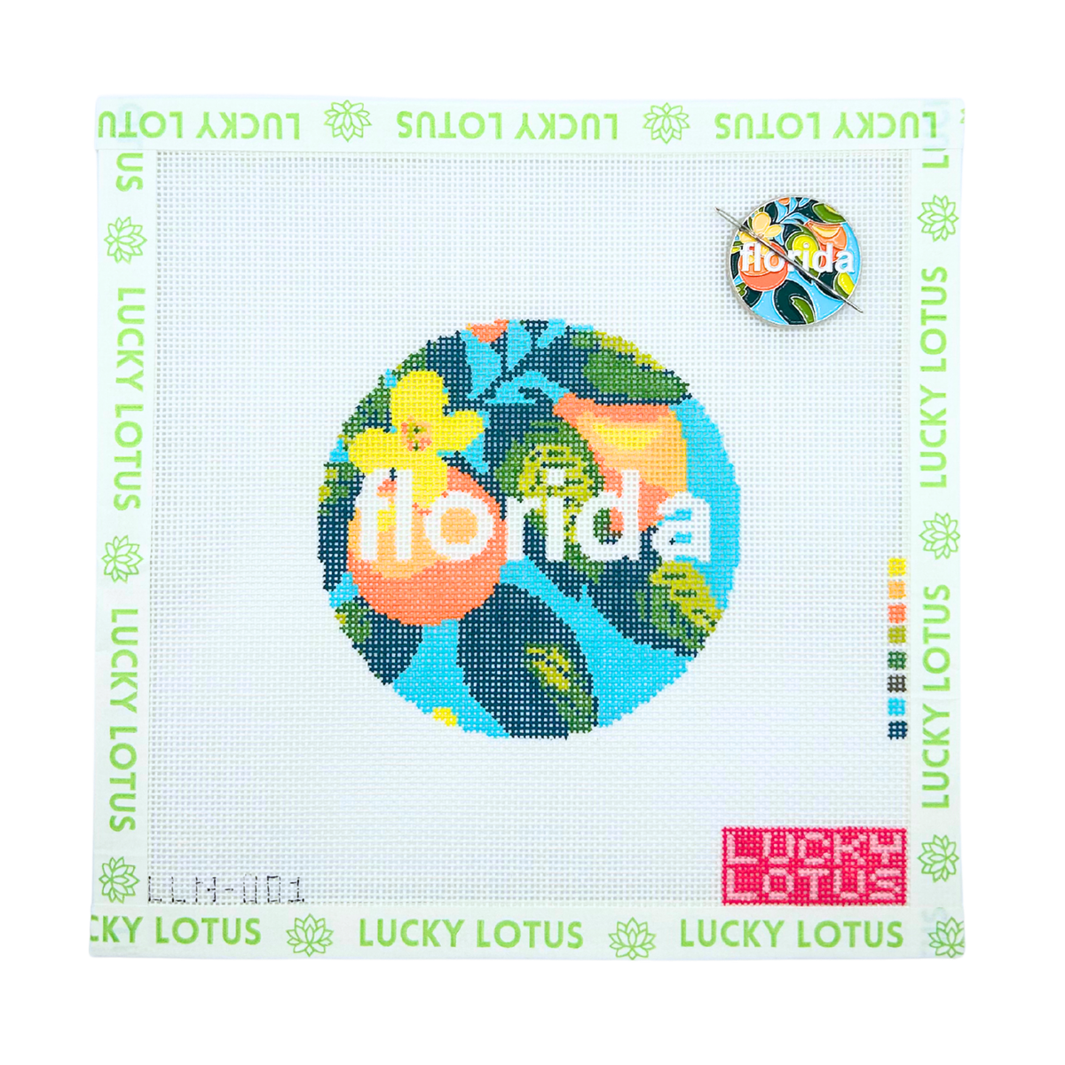 Florida needlepoint canvas featuring colorful citrus and tropical leaves with matching Florida needle minder attached
