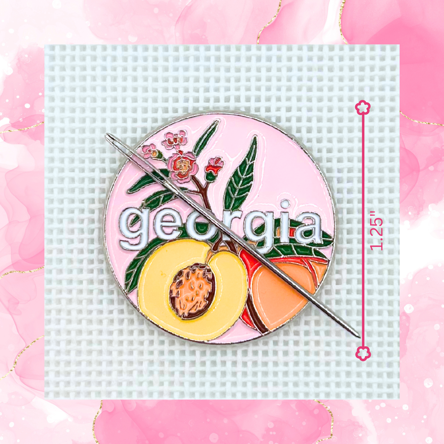 Georgia needlepoint needle minder featuring peaches and pink floral details, measuring approximately 1.25 inches.