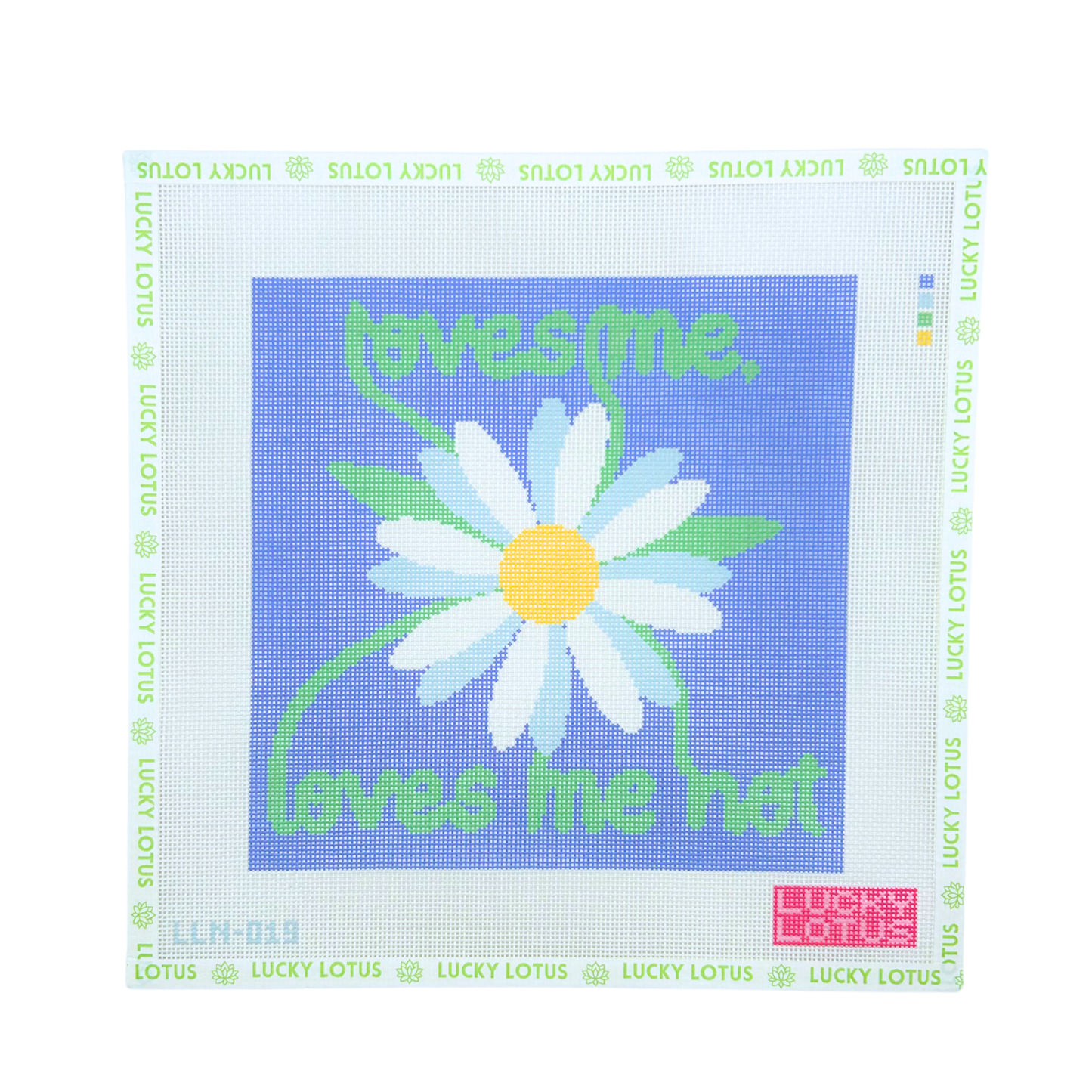Daisy needlepoint canvas with “loves me, loves me not” lettering on a periwinkle blue background