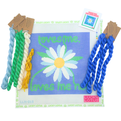 Loves Me Loves Me Not daisy needlepoint canvas with blue background and coordinating threads