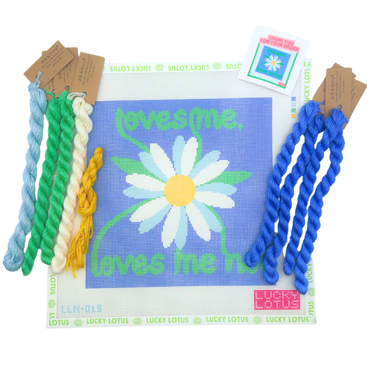 Loves Me Loves Me Not daisy needlepoint canvas with blue background and coordinating threads
