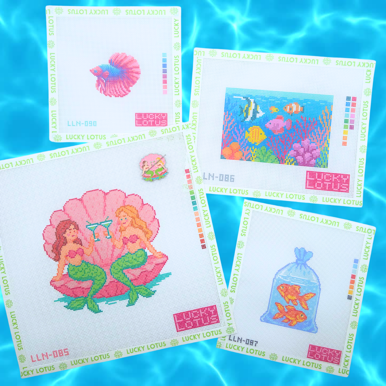 Lucky Lotus Needlepoint Summer Collection featuring a Betta Fish needlepoint canvas (18 mesh), Ocean Aquarium needlepoint canvas (13 mesh), Mermaids needlepoint canvas (13 mesh), Goldfish in a Bag needlepoint canvas (18 mesh), and a matching Mermaids needle minder displayed on a blue water background.