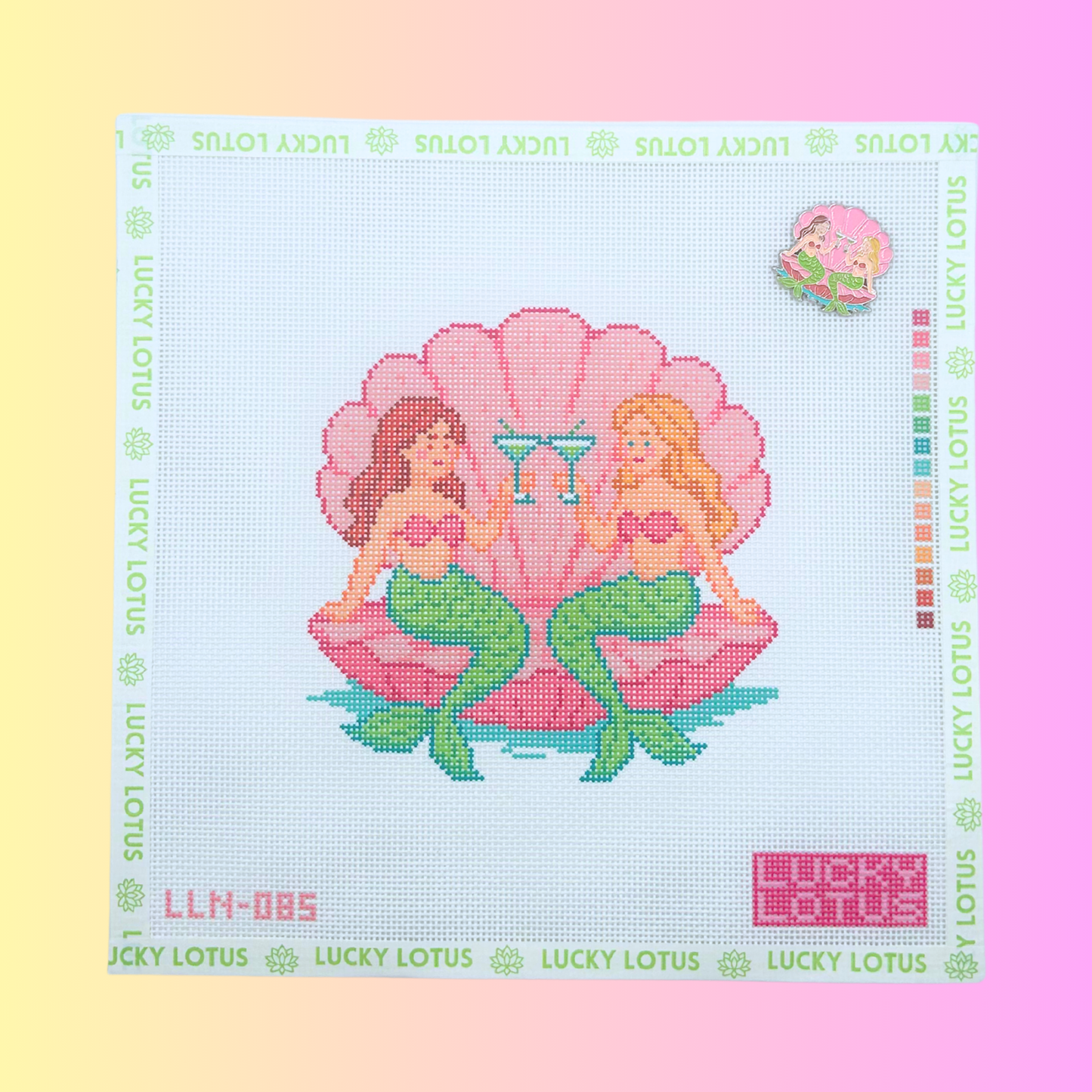 Mermaids Needlepoint Canvas with matching Mermaids Needle Minder by Lucky Lotus Needlepoint, featuring two mermaids sitting in a pink seashell while toasting with martinis.