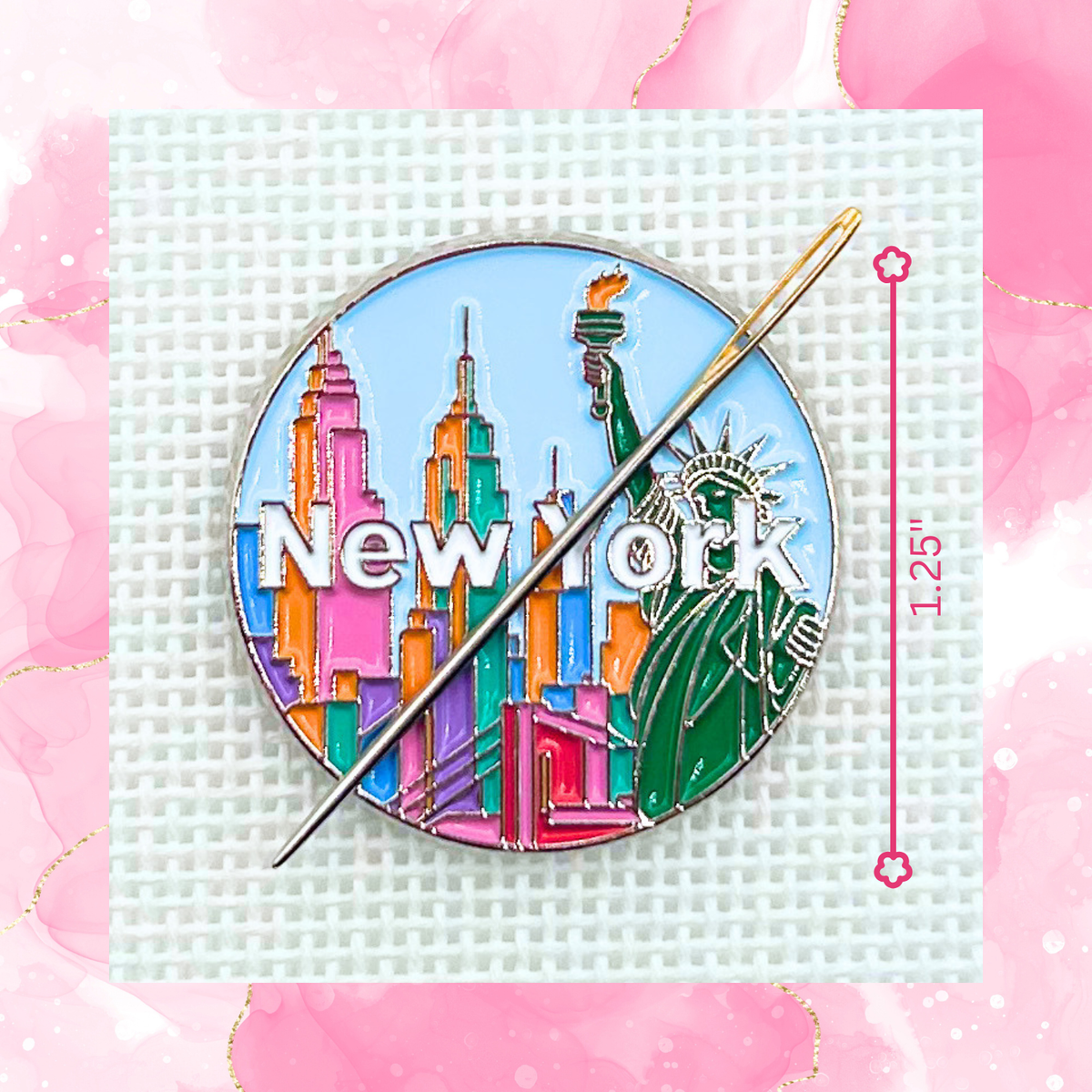 New York needle minder on needlepoint canvas featuring the Statue of Liberty, colorful skyline, and New York lettering