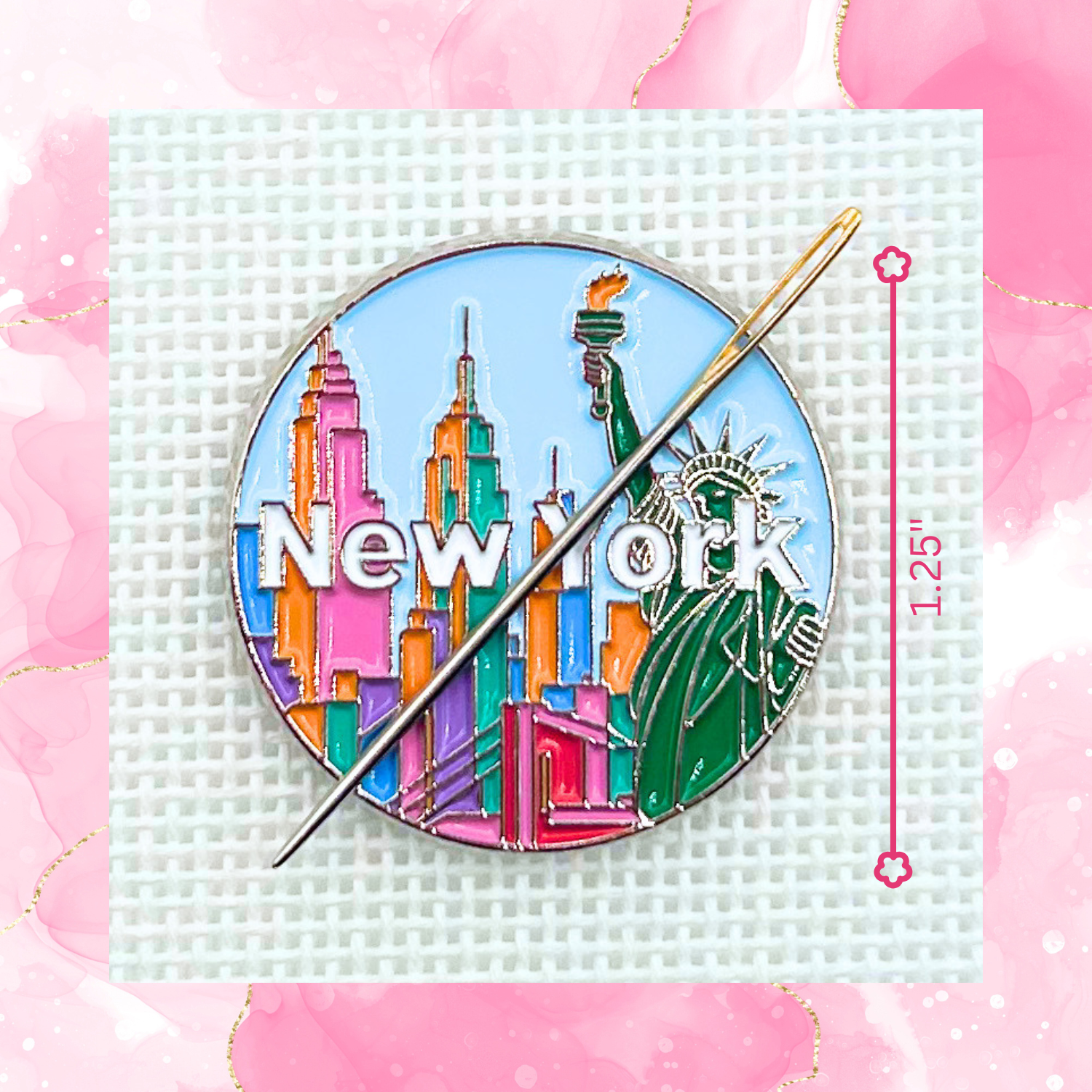 New York needle minder on needlepoint canvas featuring the Statue of Liberty, colorful skyline, and New York lettering