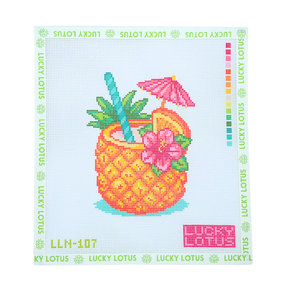 Lucky Lotus Needlepoint pineapple cocktail canvas featuring a tropical drink with pink flowers, citrus slices, palm leaves, and a pink umbrella.