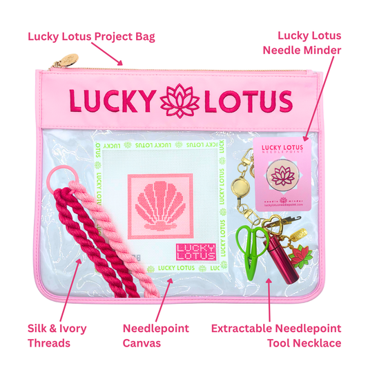 Contents of the Seashell Beginner Needlepoint Kit including hand-painted canvas, Silk & Ivory threads, project bag, needle minder, and extractable needlepoint tool keychain.