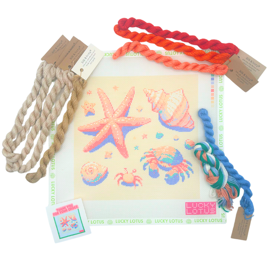 Coastal needlepoint canvas with starfish, seashells and hermit crabs with coordinating threads