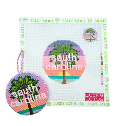 South Carolina state needlepoint canvas with matching needle minder and finished round ornament featuring a palm tree and colorful coastal sunset.