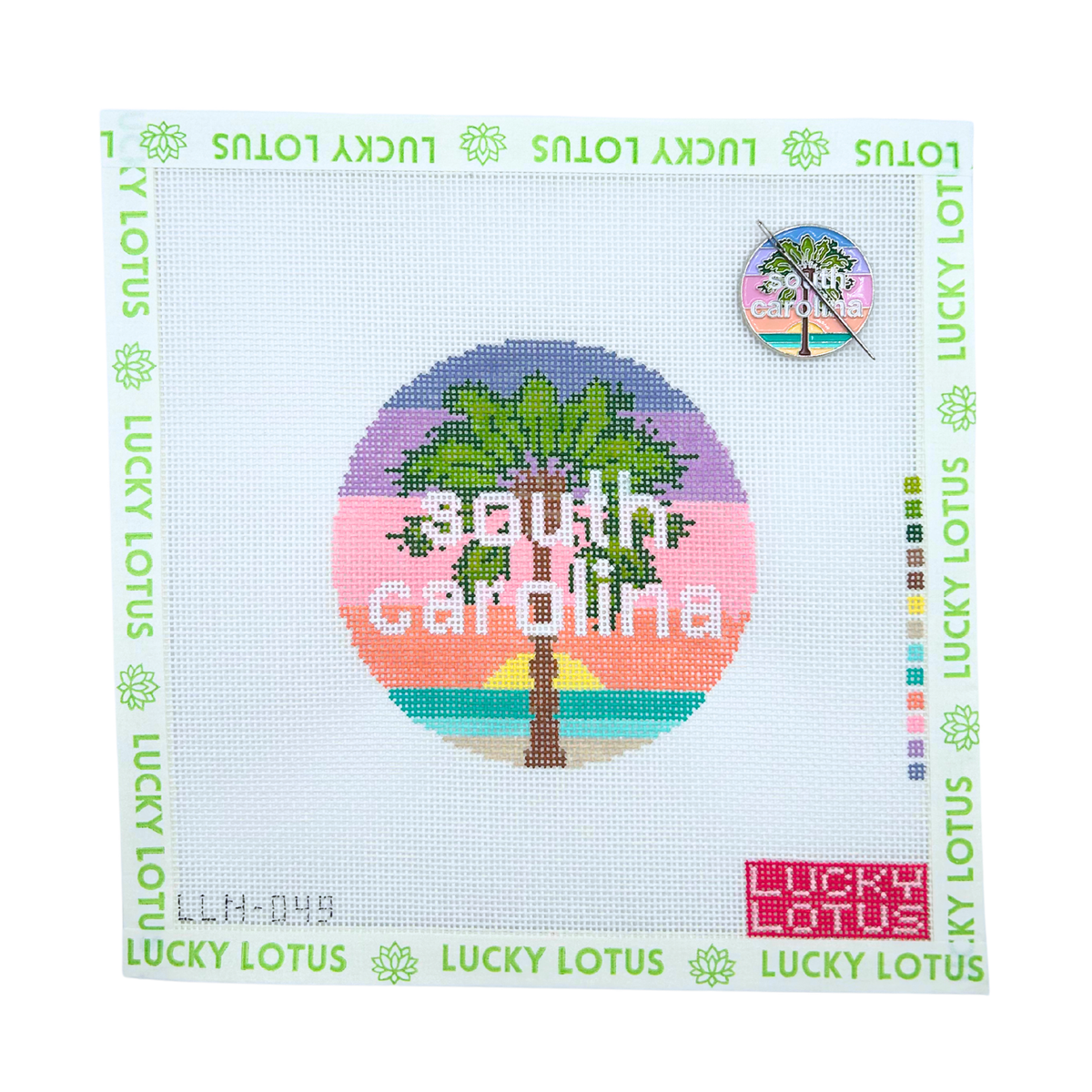 South Carolina state needlepoint canvas featuring a palm tree and colorful coastal sunset with the matching South Carolina needle minder.