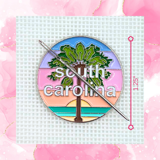 South Carolina needlepoint needle minder close up featuring a palm tree and colorful coastal sunset design.