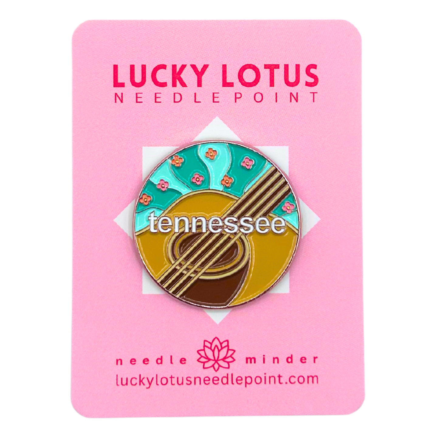 Tennessee needle minder featuring an acoustic guitar, colorful wildflowers, turquoise background, and Tennessee lettering.