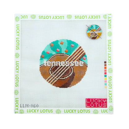 Tennessee state needlepoint canvas featuring an acoustic guitar and colorful floral details with the matching Tennessee needle minder.