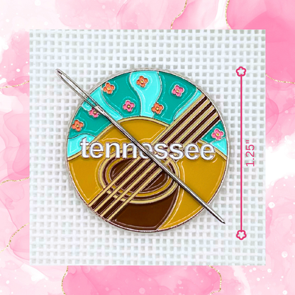 Tennessee needlepoint needle minder close up featuring an acoustic guitar and colorful floral details.